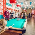 People playing pool at the retro-themed High Rollers