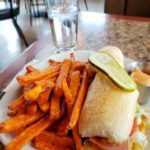 Close up of club sandwich and sweet potato fries taken during lunch at Patrino's