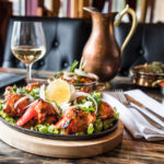 Indian cuisine on a set table at Masala